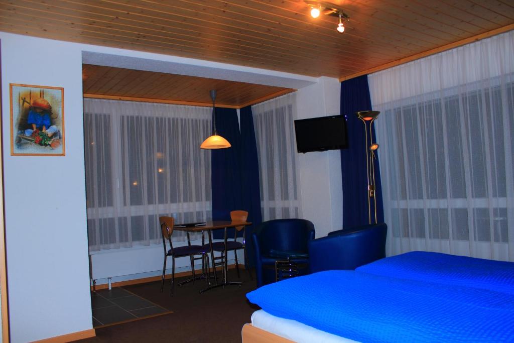 Postel nebo postele na pokoji v ubytování Hotel Alpha