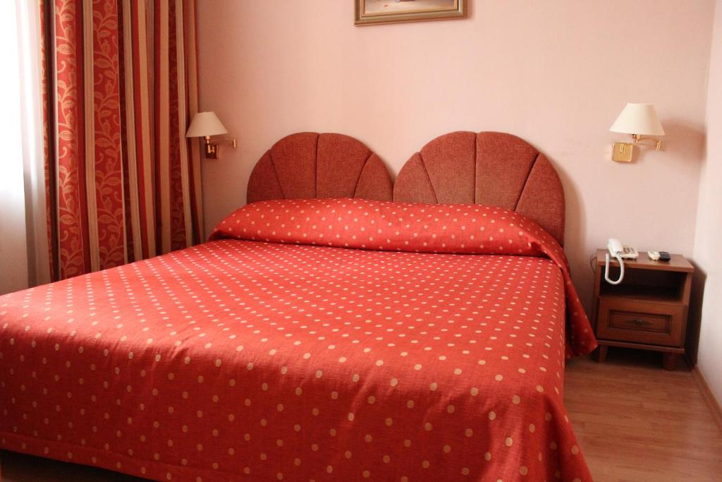 Postel nebo postele na pokoji v ubytování Domus Hotel-1