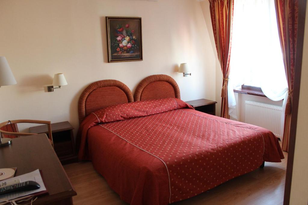 Postel nebo postele na pokoji v ubytování Domus Hotel-1