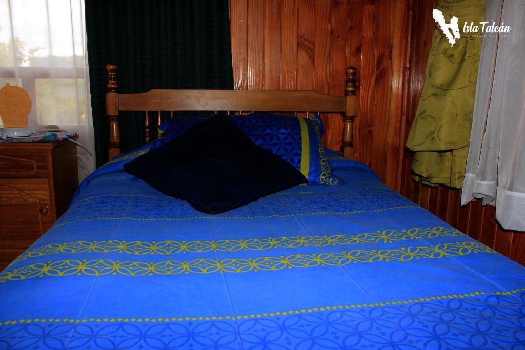 Cama o camas de una habitación en Hospedaje Isla Talcan