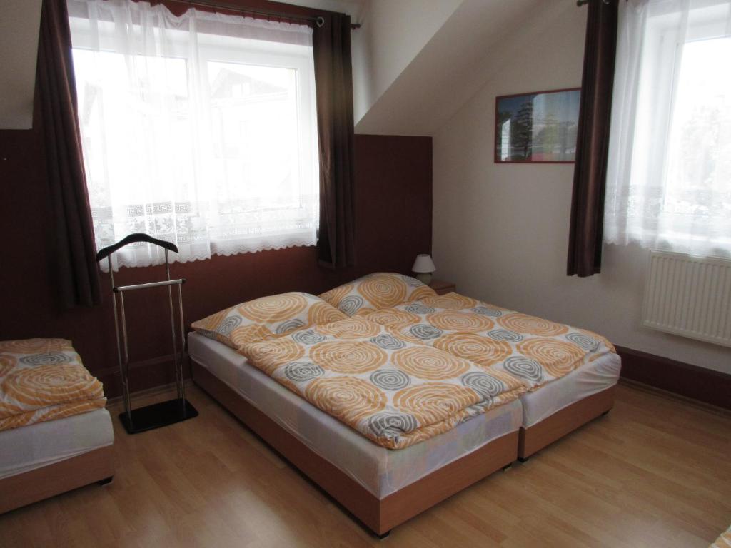 Postel nebo postele na pokoji v ubytování Apartmany Jaruska