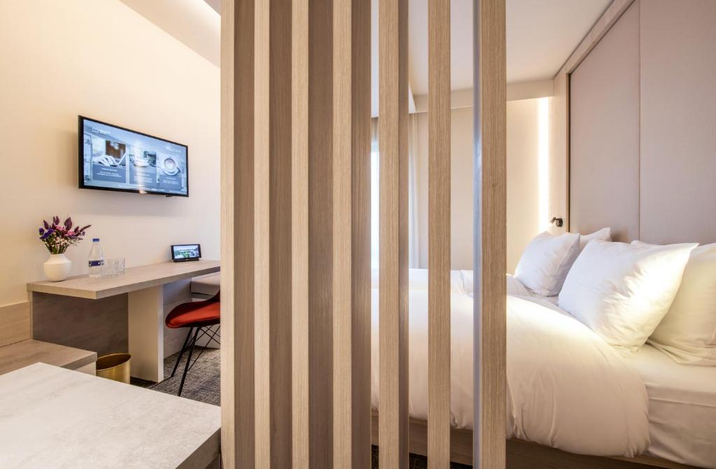 Postel nebo postele na pokoji v ubytování Begijnhof Hotel