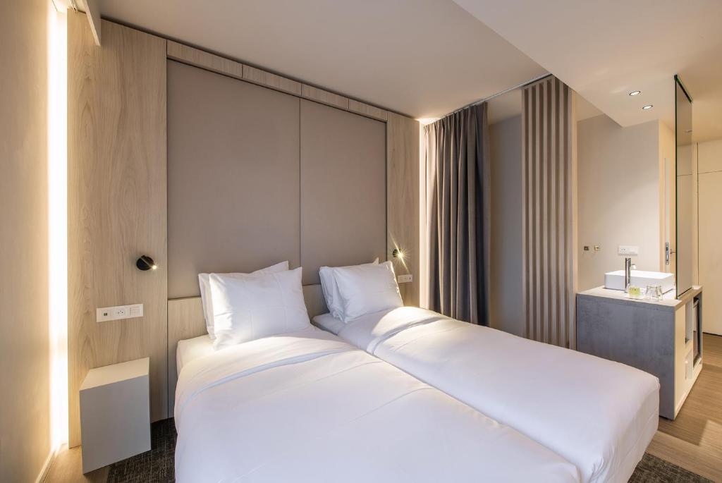 Postel nebo postele na pokoji v ubytování Begijnhof Hotel