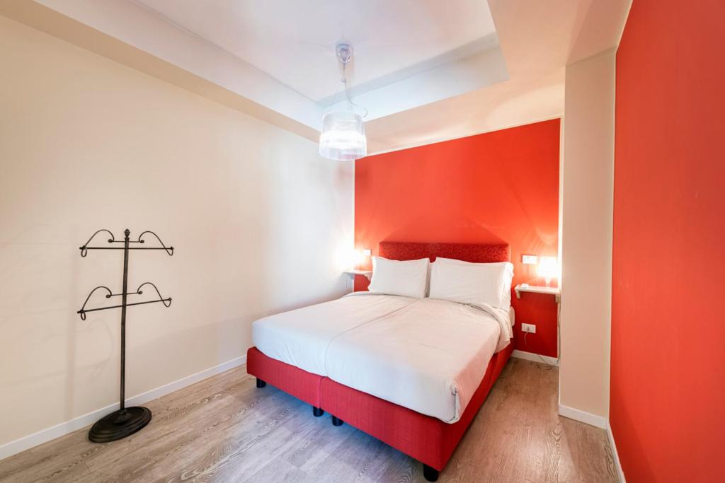 Een bed of bedden in een kamer bij Residence Lenno