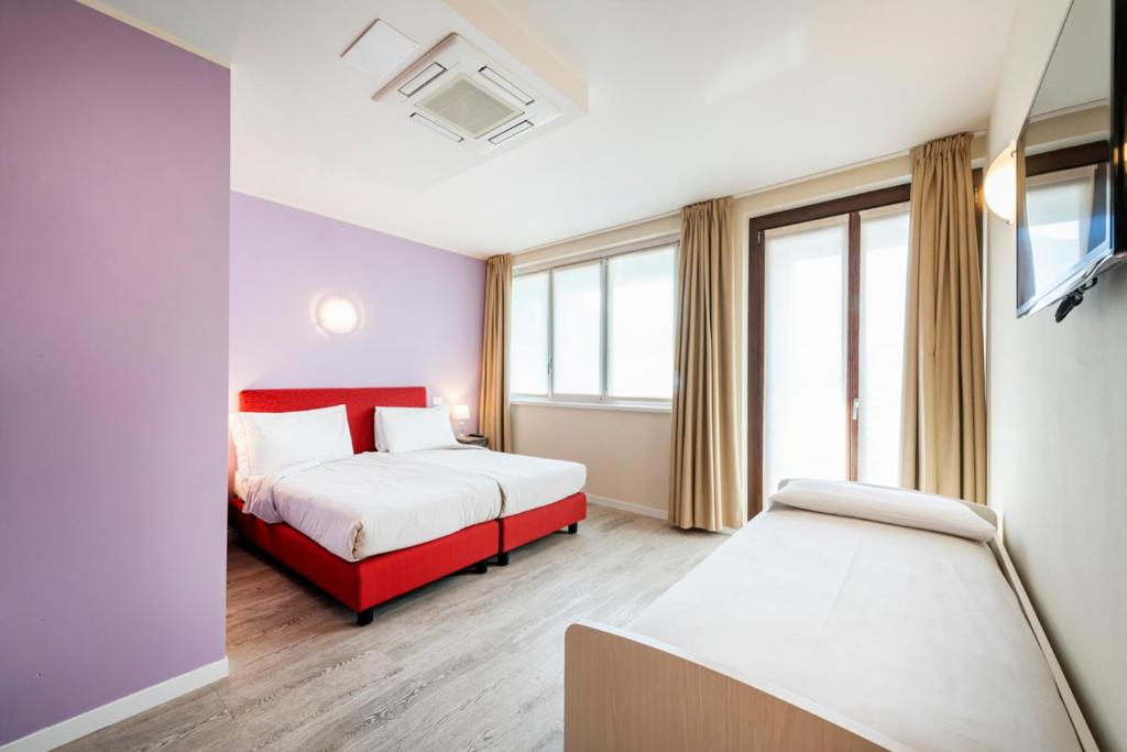 Een bed of bedden in een kamer bij Residence Lenno
