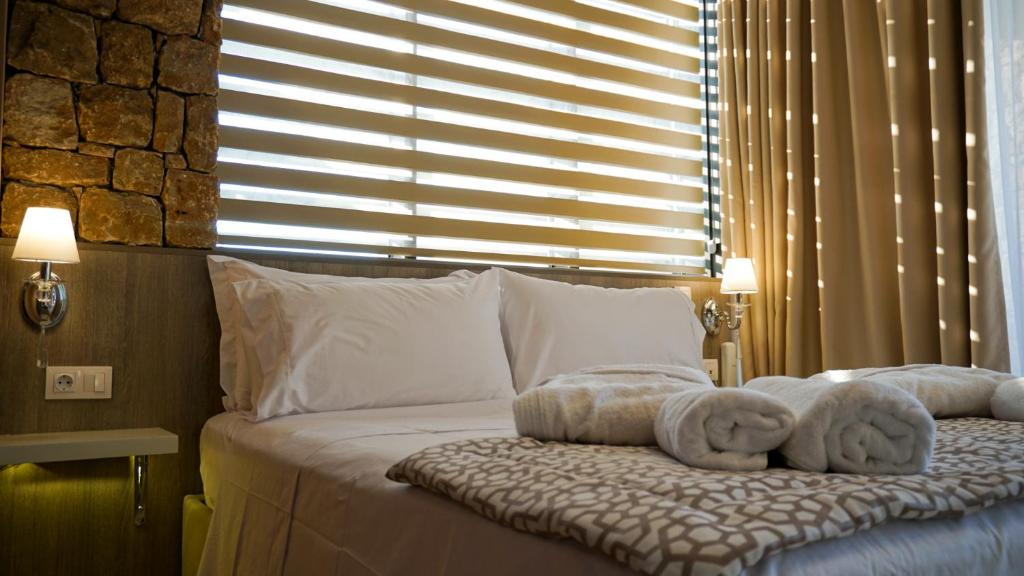 Postel nebo postele na pokoji v ubytování Agnes Deluxe Hotel