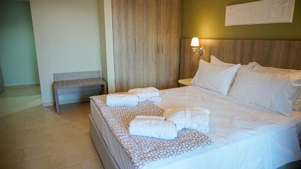 Postel nebo postele na pokoji v ubytování Agnes Deluxe Hotel