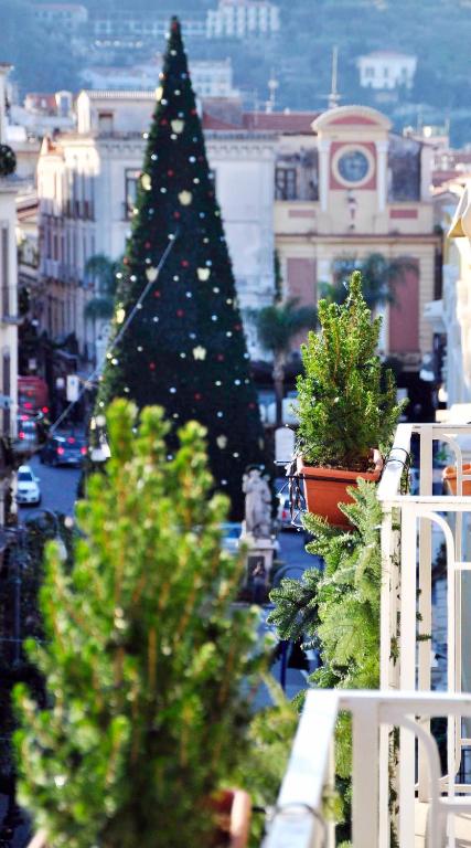 a christmas tree on the balcony of a building at Sorrento Flats in Sorrento