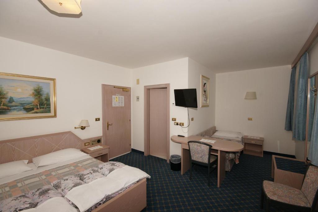 Postel nebo postele na pokoji v ubytování Hotel Villa Mozart