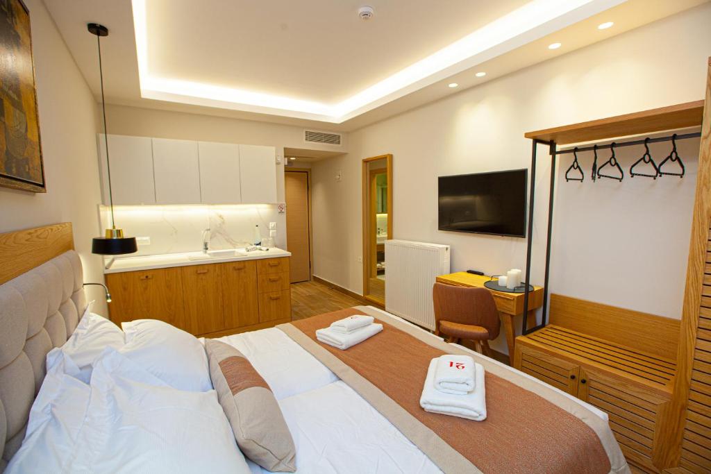 Postel nebo postele na pokoji v ubytování No21 Luxury Suites