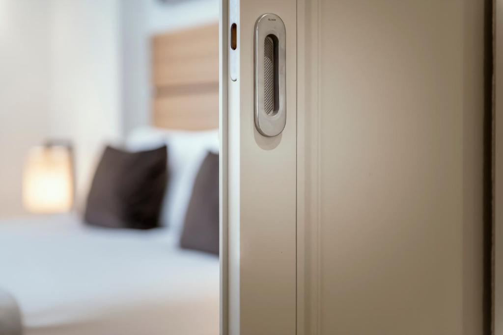 Postel nebo postele na pokoji v ubytování Hotel Ambasciatori