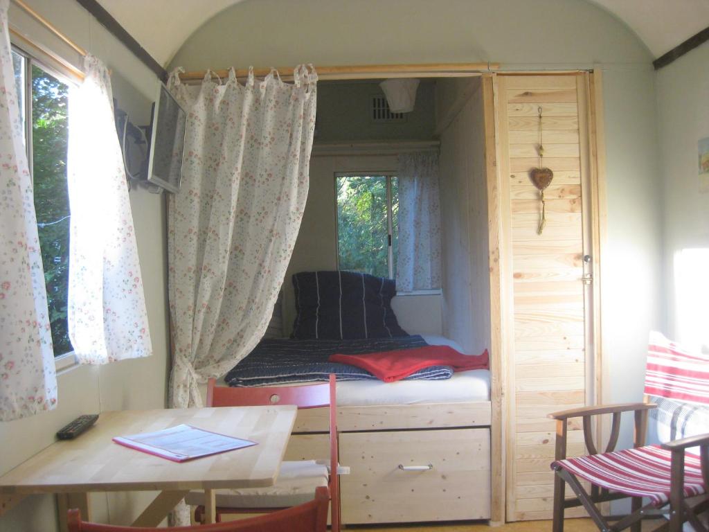 Postel nebo postele na pokoji v ubytování Up'Lodge