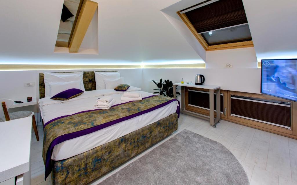 Postel nebo postele na pokoji v ubytování Diamond Rain Boutique Hotel