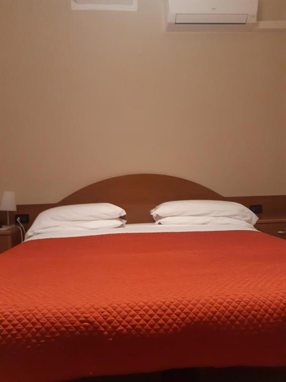 Łóżko lub łóżka w pokoju w obiekcie Hotel Due Gemelli