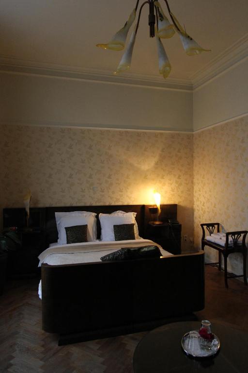 Postel nebo postele na pokoji v ubytování Hotel Dufays