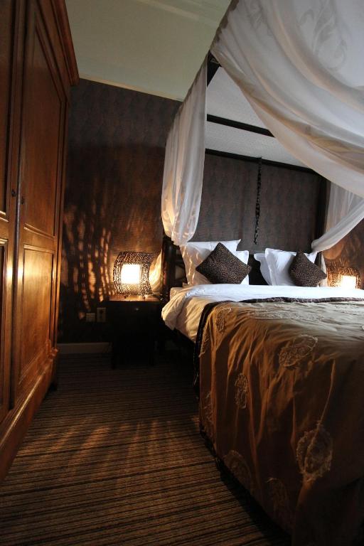 Postel nebo postele na pokoji v ubytování Hotel Dufays