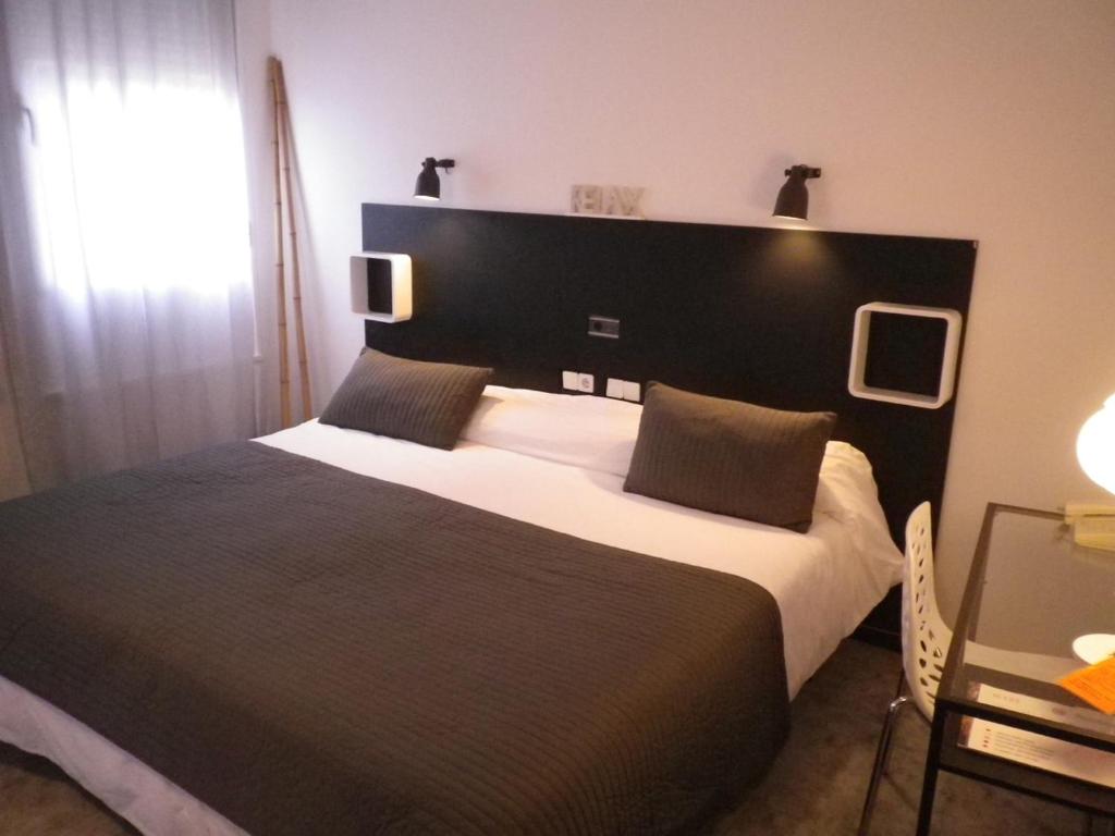 Postel nebo postele na pokoji v ubytování Hotel Rio Piedra