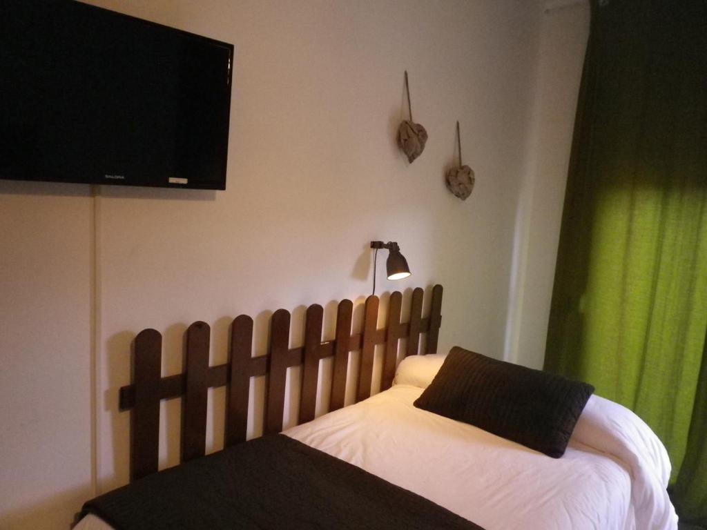 Postel nebo postele na pokoji v ubytování Hotel Rio Piedra