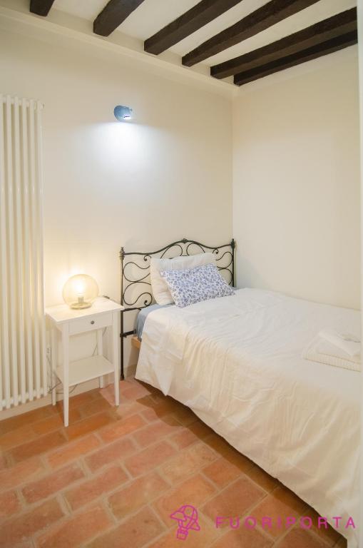 Posteľ alebo postele v izbe v ubytovaní Residenza New Dalmazia 6
