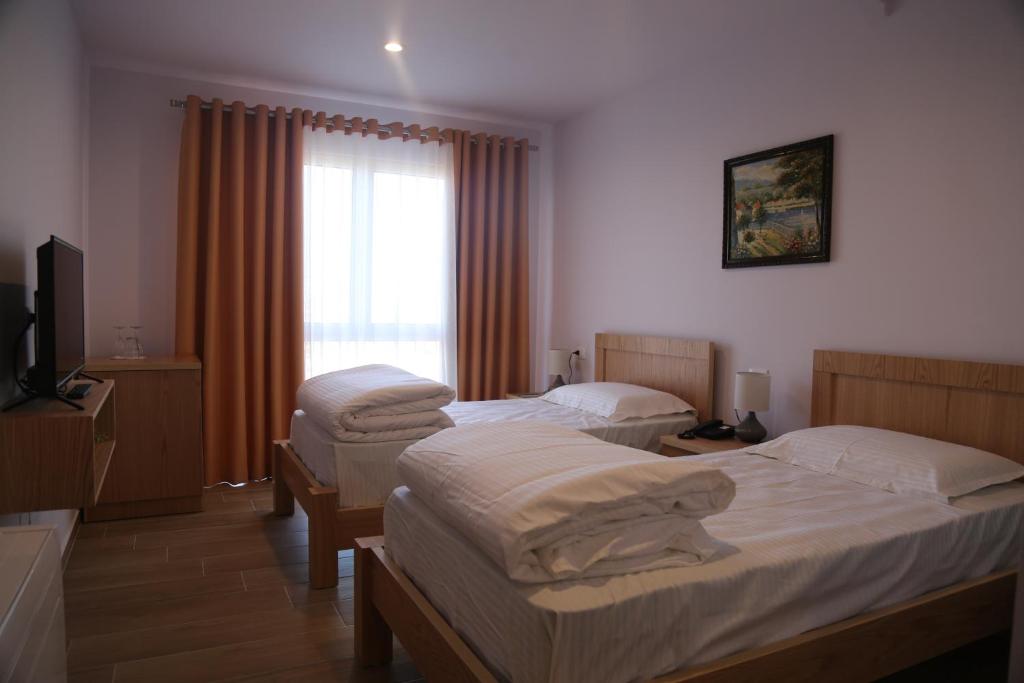 Postel nebo postele na pokoji v ubytování Resort Nord Park