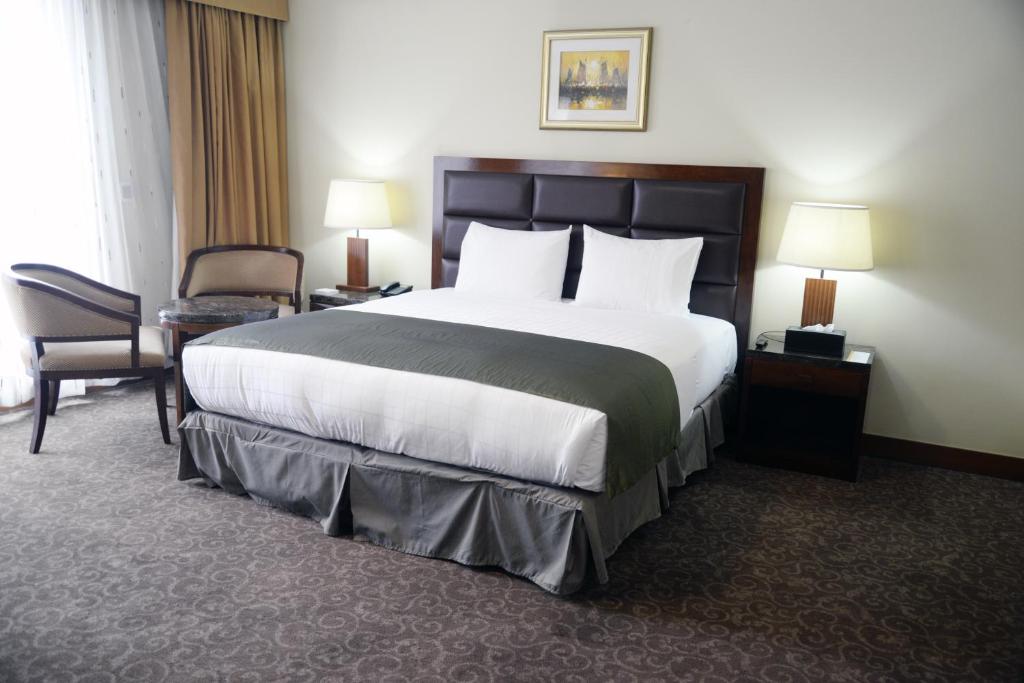 Postel nebo postele na pokoji v ubytování Hotel Stanford