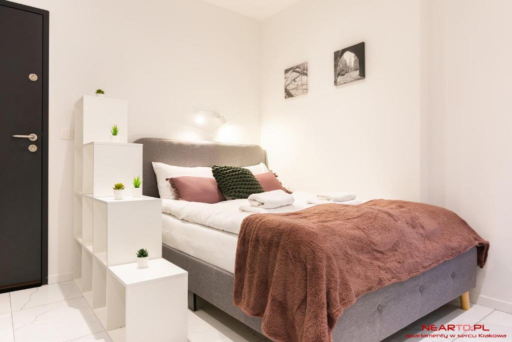 Cama ou camas em um quarto em Apartment nearto Old Town Halicka street