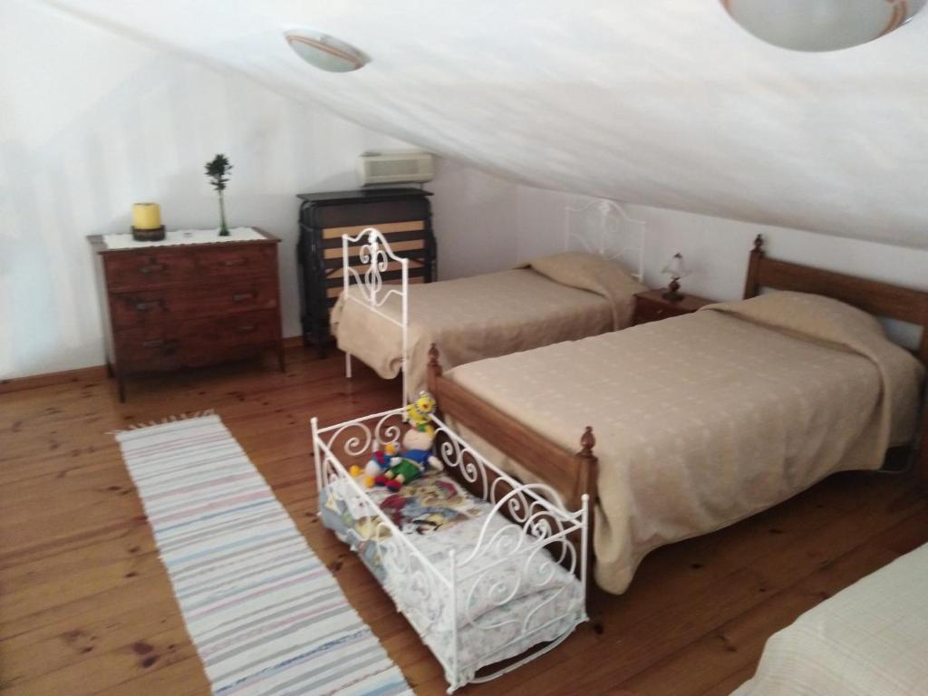 Tempat tidur dalam kamar di Adega Ilhéu
