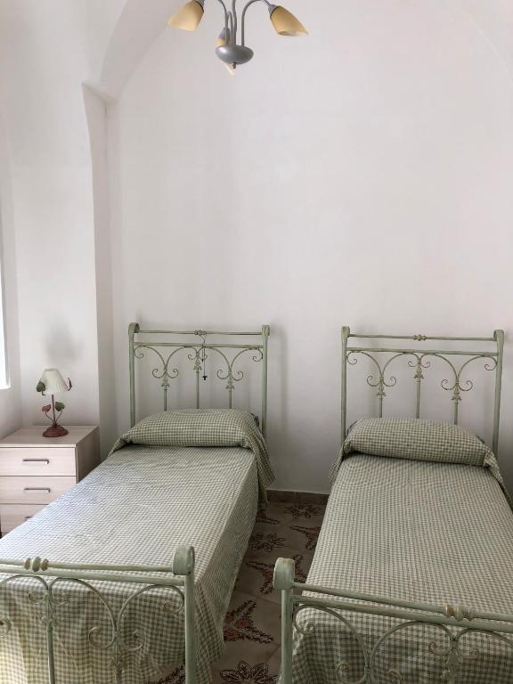 Łóżko lub łóżka w pokoju w obiekcie Gabriele-Apartment
