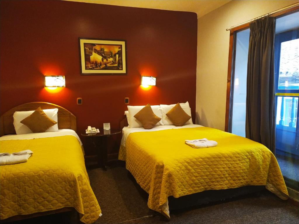 Postel nebo postele na pokoji v ubytování HOTEL AMTALLPA San Blas Inn