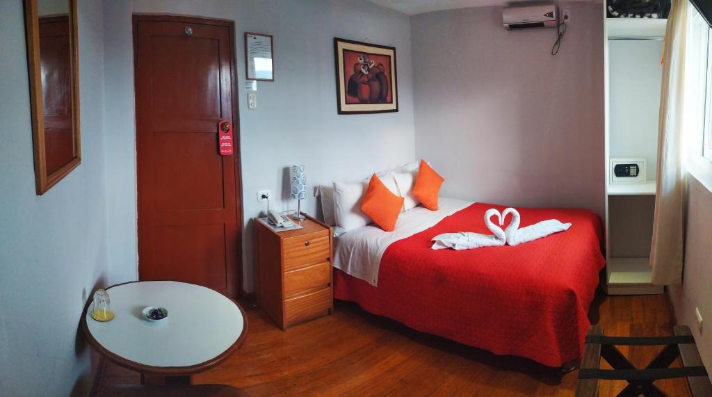Postel nebo postele na pokoji v ubytování HOTEL AMTALLPA San Blas Inn