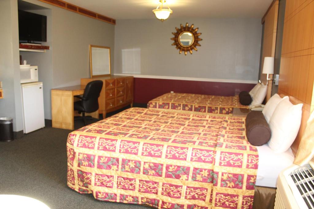 Postel nebo postele na pokoji v ubytování Liberty Inn Absecon Atlantic City