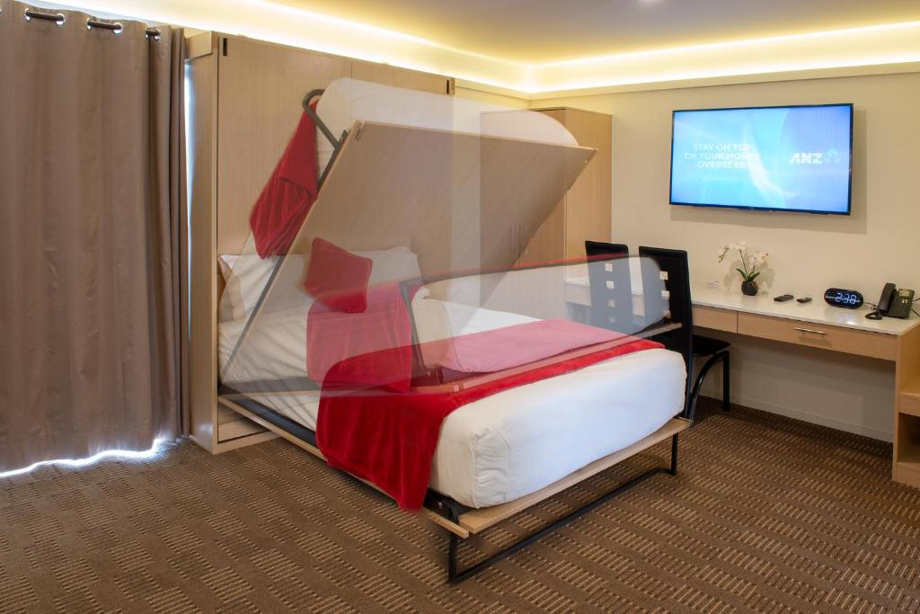 Postel nebo postele na pokoji v ubytování V Motel