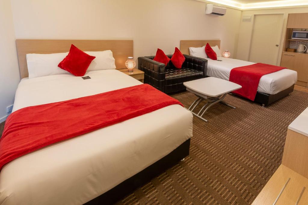 Postel nebo postele na pokoji v ubytování V Motel