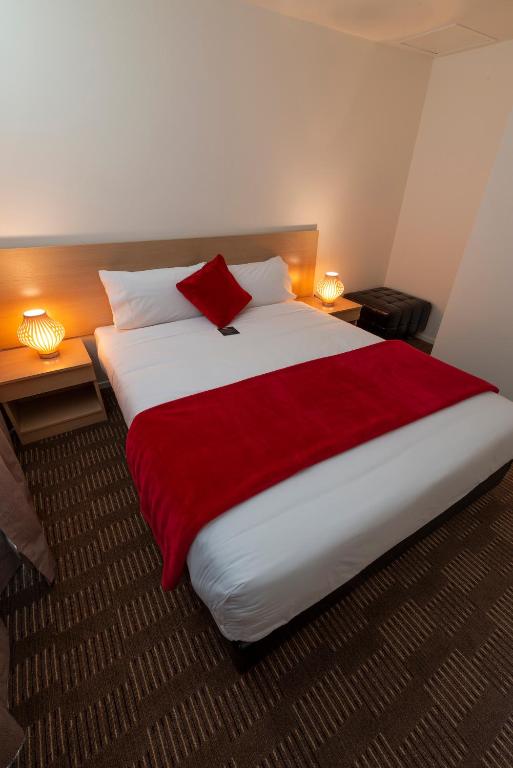 Postel nebo postele na pokoji v ubytování V Motel