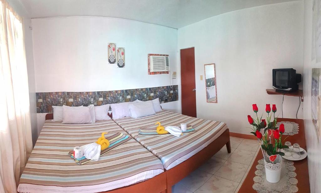 Postel nebo postele na pokoji v ubytování WHITE BEACH GUEST HOUSE