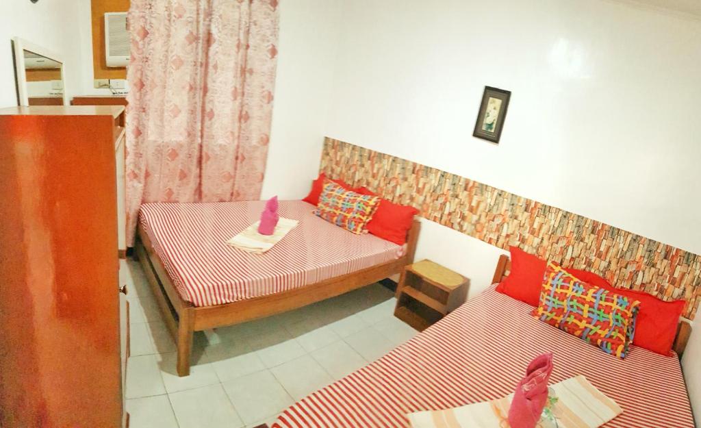 Postel nebo postele na pokoji v ubytování WHITE BEACH GUEST HOUSE