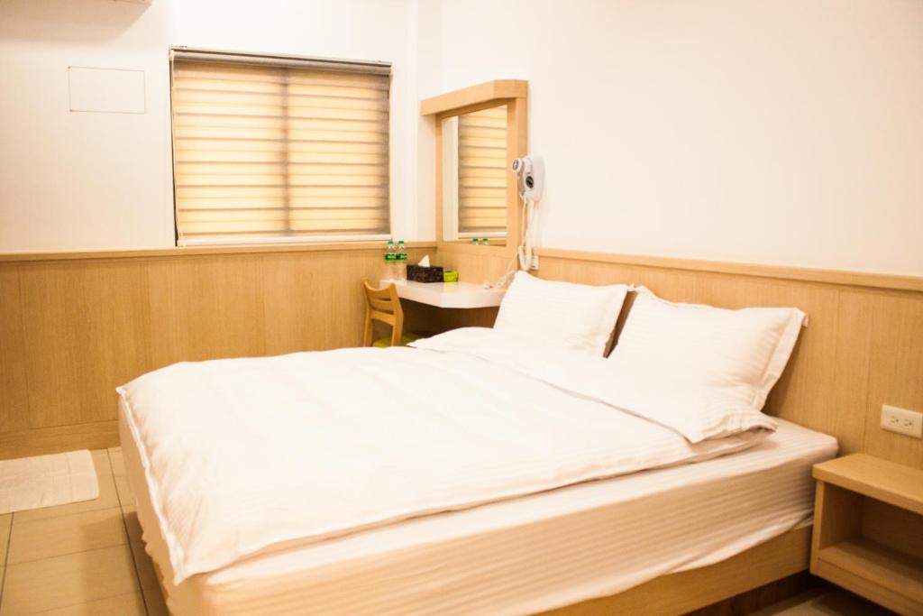 Postel nebo postele na pokoji v ubytování Yellow Mountain Homestay