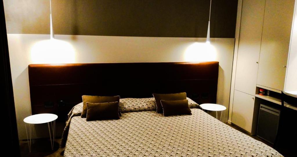 Postel nebo postele na pokoji v ubytování Albergo Suisse Bellevue