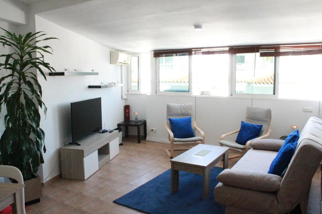 Televízia a/alebo spoločenská miestnosť v ubytovaní Apartment Sirena Beach