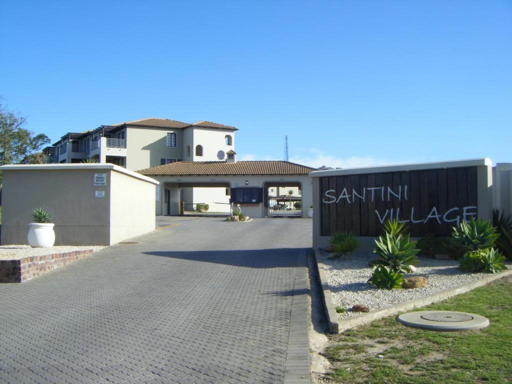 a driveway leading to a house with a fence at Plett Sunrise:) in Plettenberg Bay