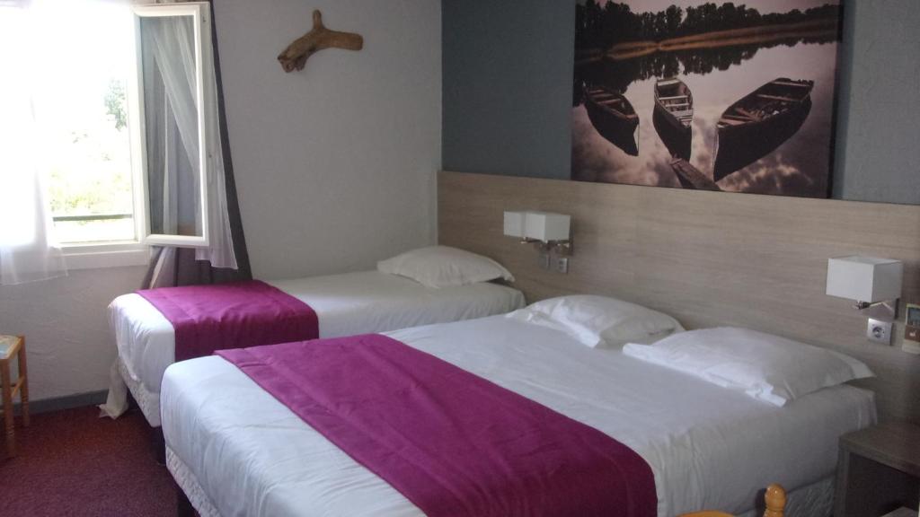 Postel nebo postele na pokoji v ubytování Atoll Hotel restaurant