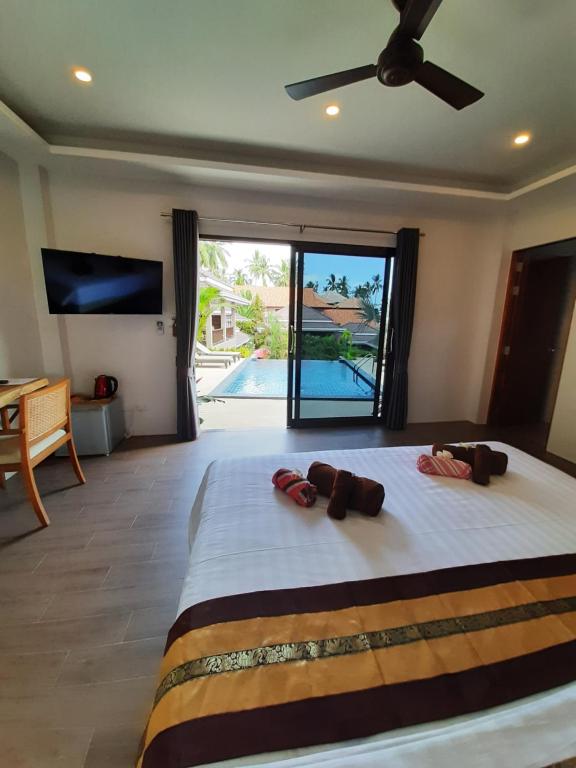 Postel nebo postele na pokoji v ubytování Baan Sawan Samui Resort