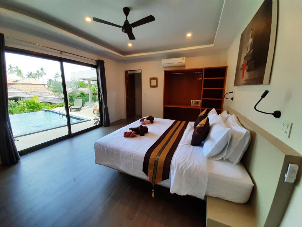 Postel nebo postele na pokoji v ubytování Baan Sawan Samui Resort