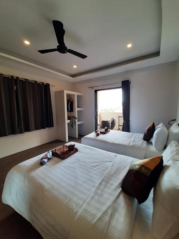 Postel nebo postele na pokoji v ubytování Baan Sawan Samui Resort
