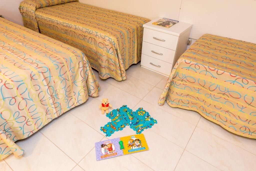 Postel nebo postele na pokoji v ubytování Hotel Palace Magnolia SPA