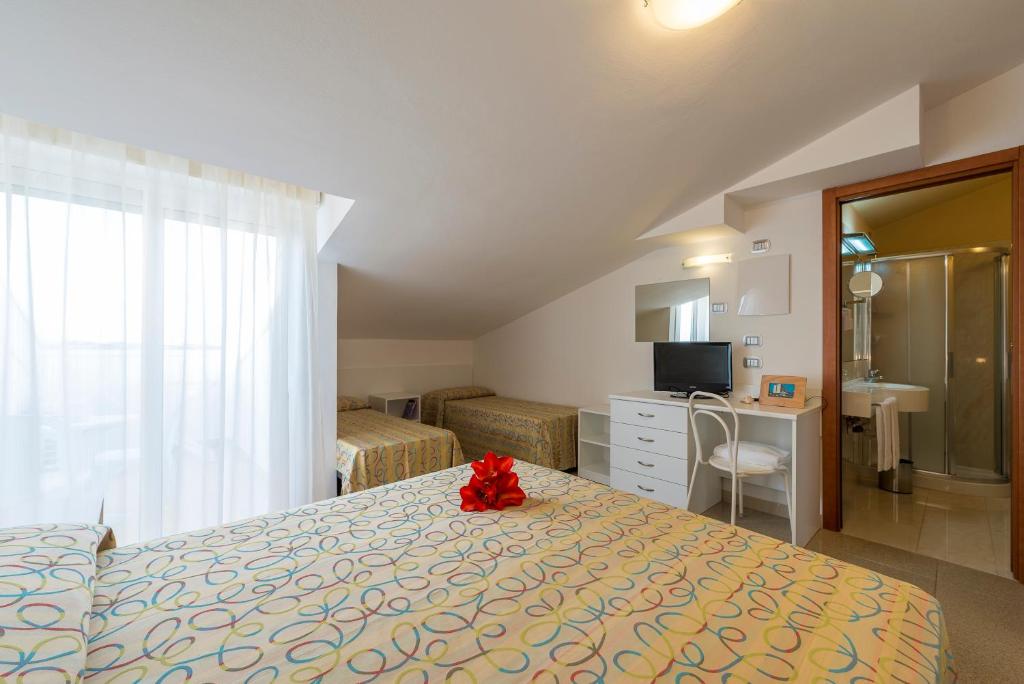 Postel nebo postele na pokoji v ubytování Hotel Palace Magnolia SPA