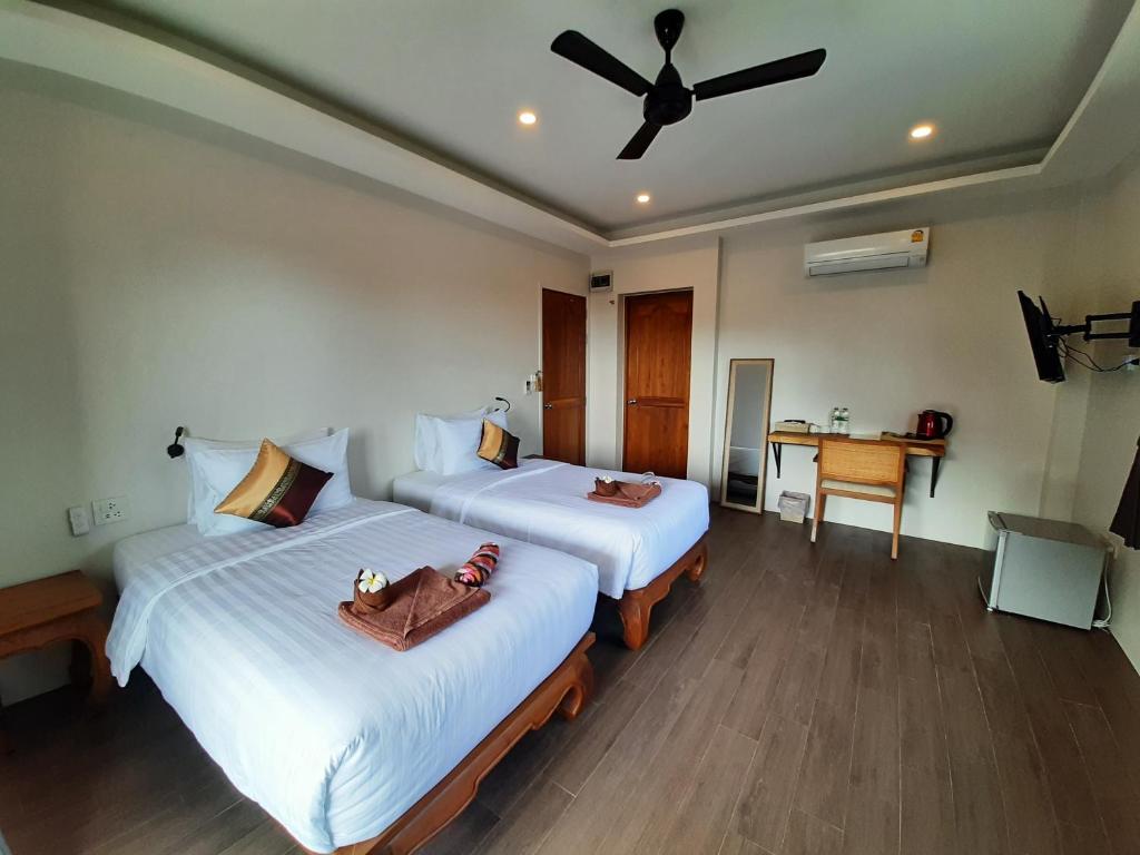 Postel nebo postele na pokoji v ubytování Baan Sawan Samui Resort