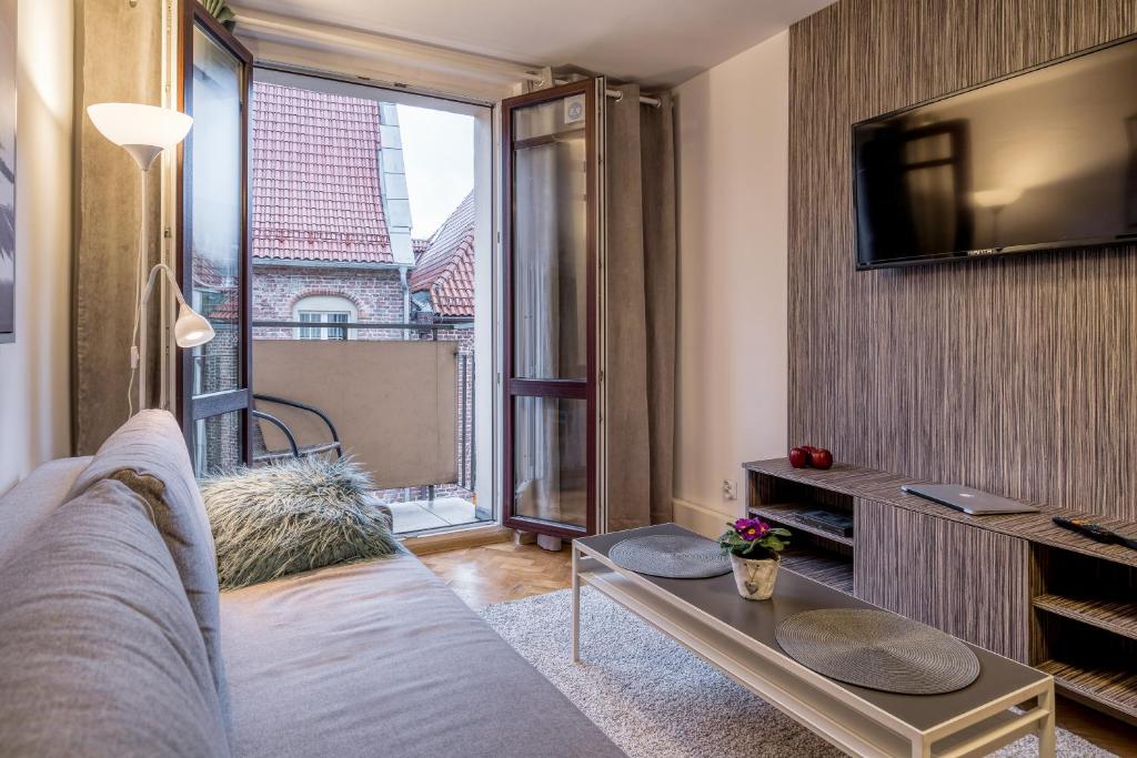 Televízia a/alebo spoločenská miestnosť v ubytovaní Grelewicz Apartments-MyPlace