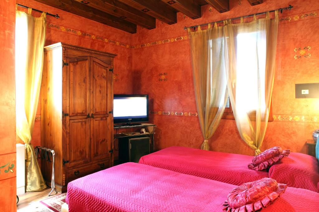 Postel nebo postele na pokoji v ubytování Hotel Tabina