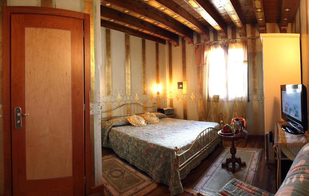 Postel nebo postele na pokoji v ubytování Hotel Tabina